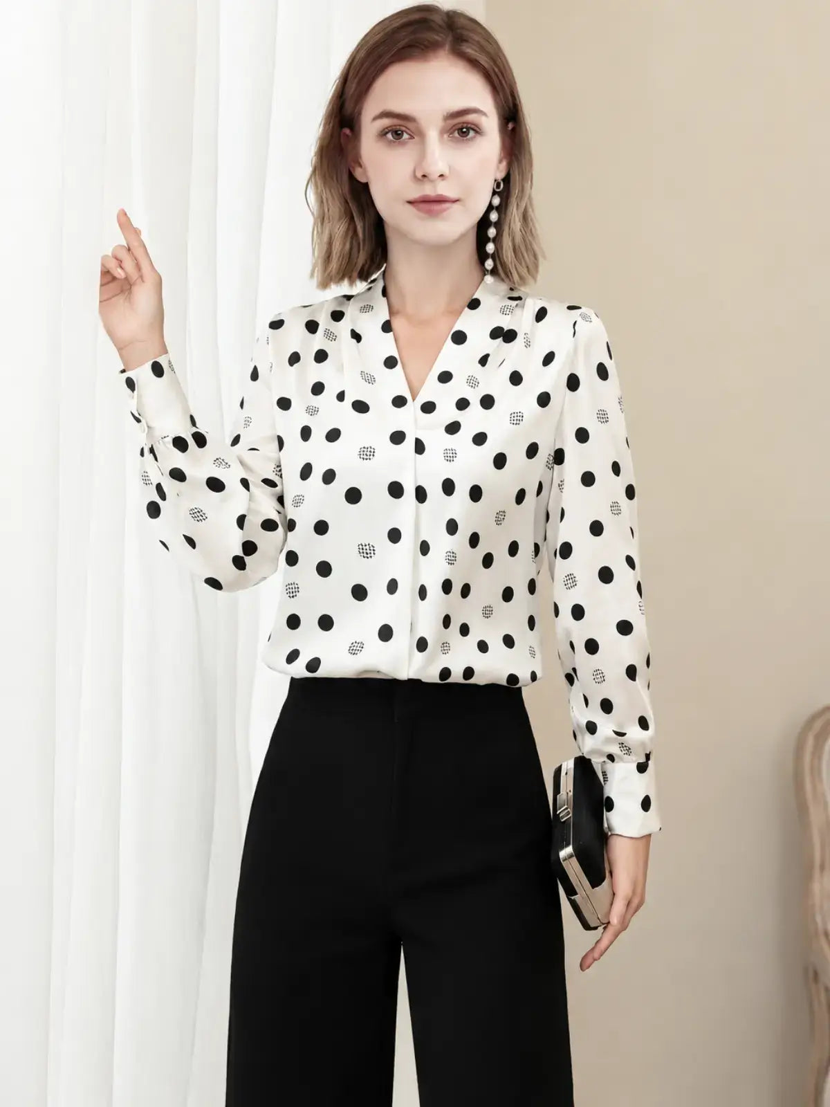 Polka Dot V-neck Mulberry Silk Blouse worn with black pants, showcasing a stylish back view.-SILKSER