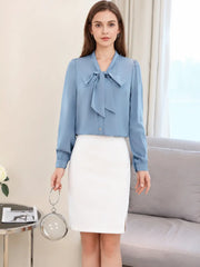 a woman wearing a Ribbon Tie Mulberry Silk Blouse paired with a black skirt, highlighting elegant style SILKSER