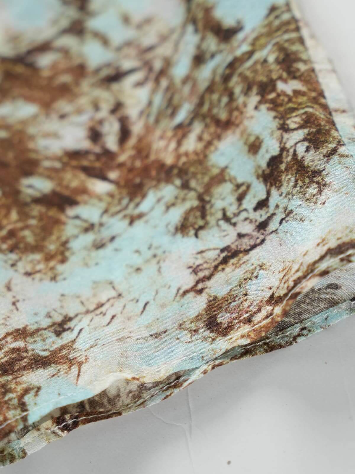 Close-up of the vintage print on a Vintage Print Mulberry Silk Dress showcasing its luxurious texture and colors.