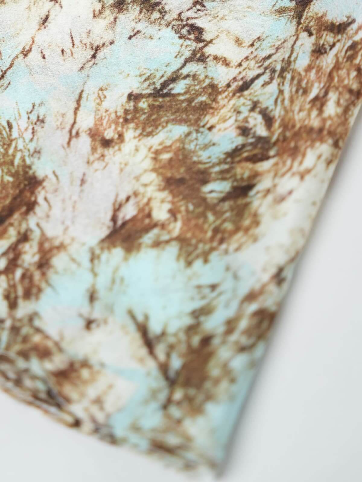 Close-up detail of the vintage print on a Vintage Print Mulberry Silk Dress showcasing the luxurious fabric texture.